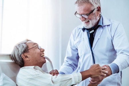 Depositphotos 242550540 stock photo mature doctor talking examining health